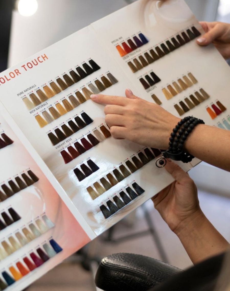 Hair Color Specialist Boca Raton 4 Stylist choosing a shade from a color chart – Hair Color Specialist Boca Raton, Hairmess Salon